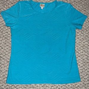 Petite woman's turquoise short sleeve top